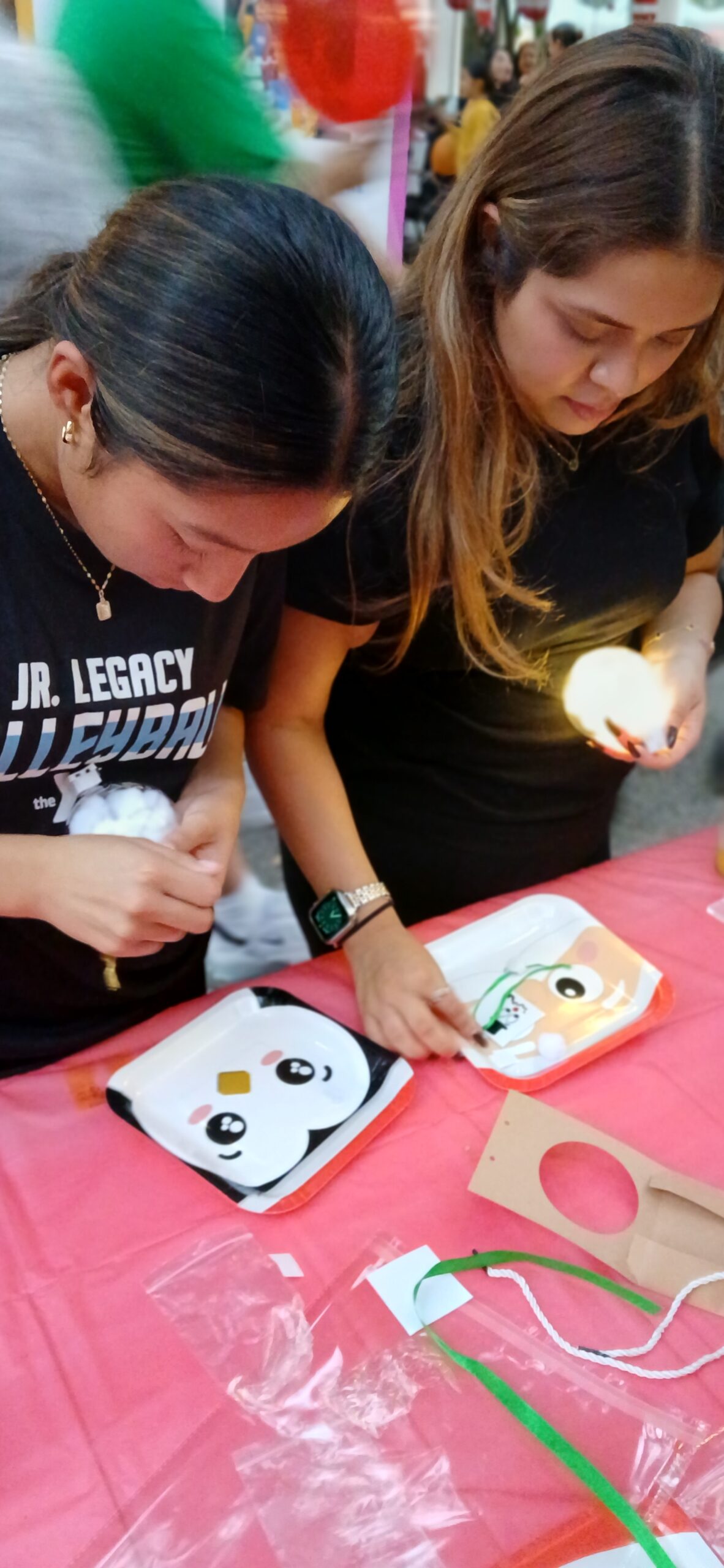 Participants personalizing creative projects together at an Imagination Squad activity