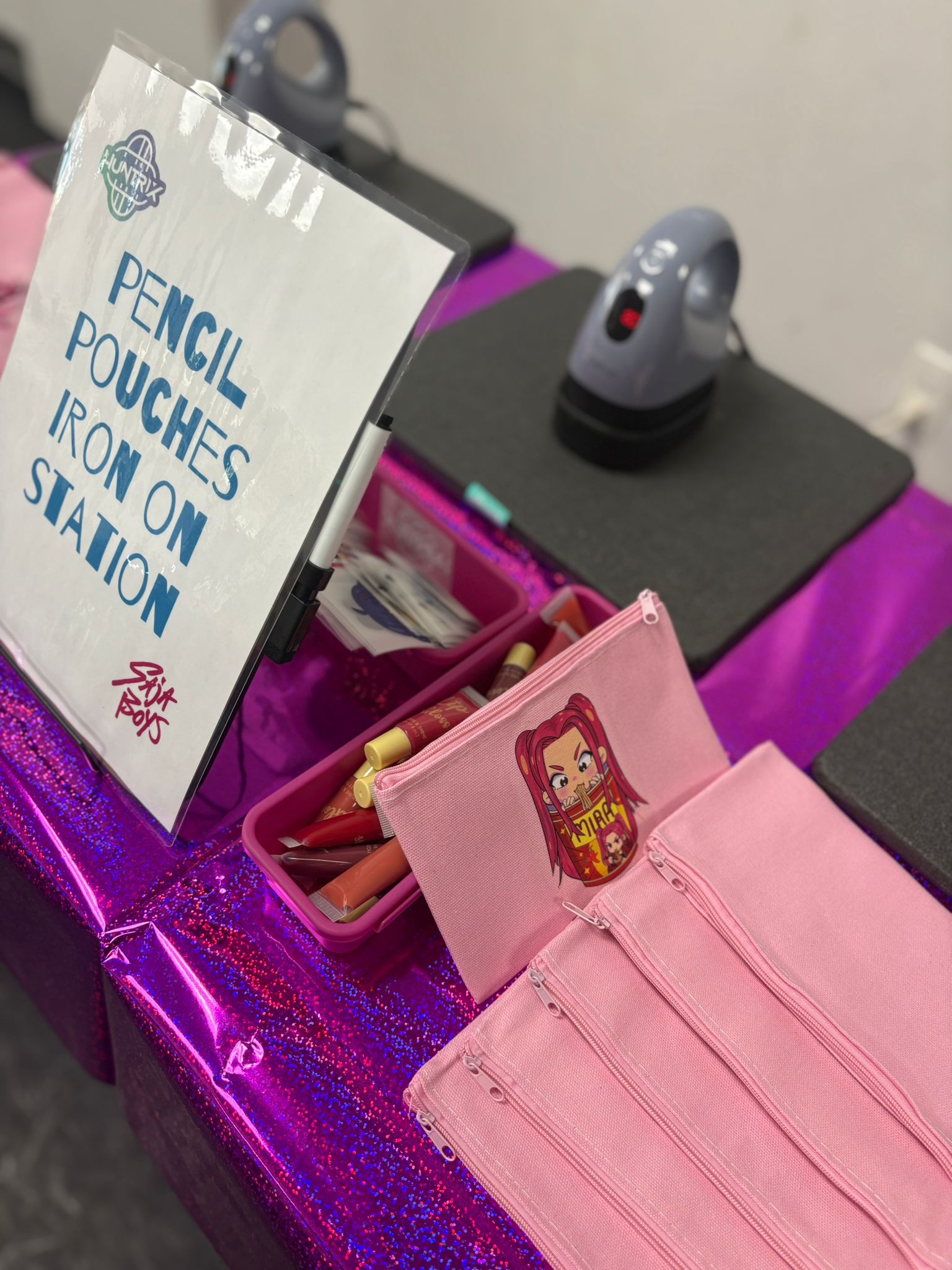 An iron-on pencil pouch activity station with personalized materials
