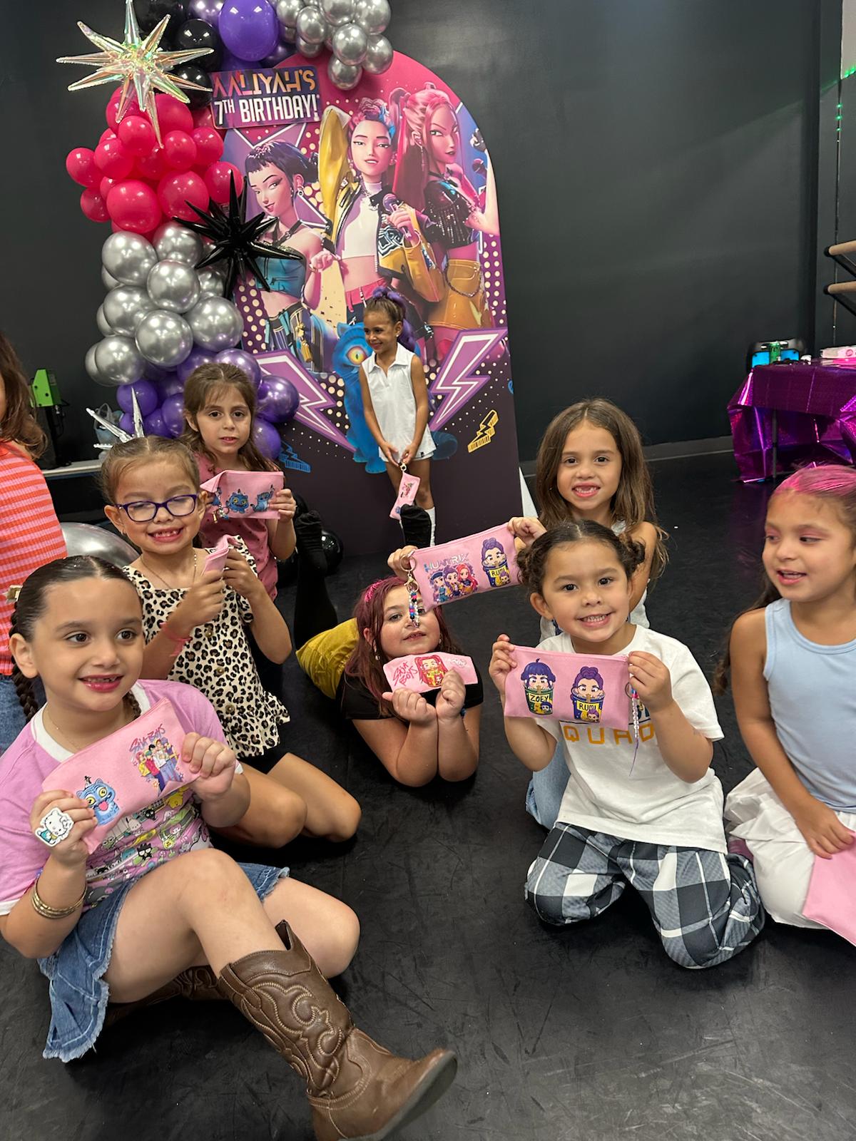 Children proudly showing their personalized creations at an Imagination Squad celebration
